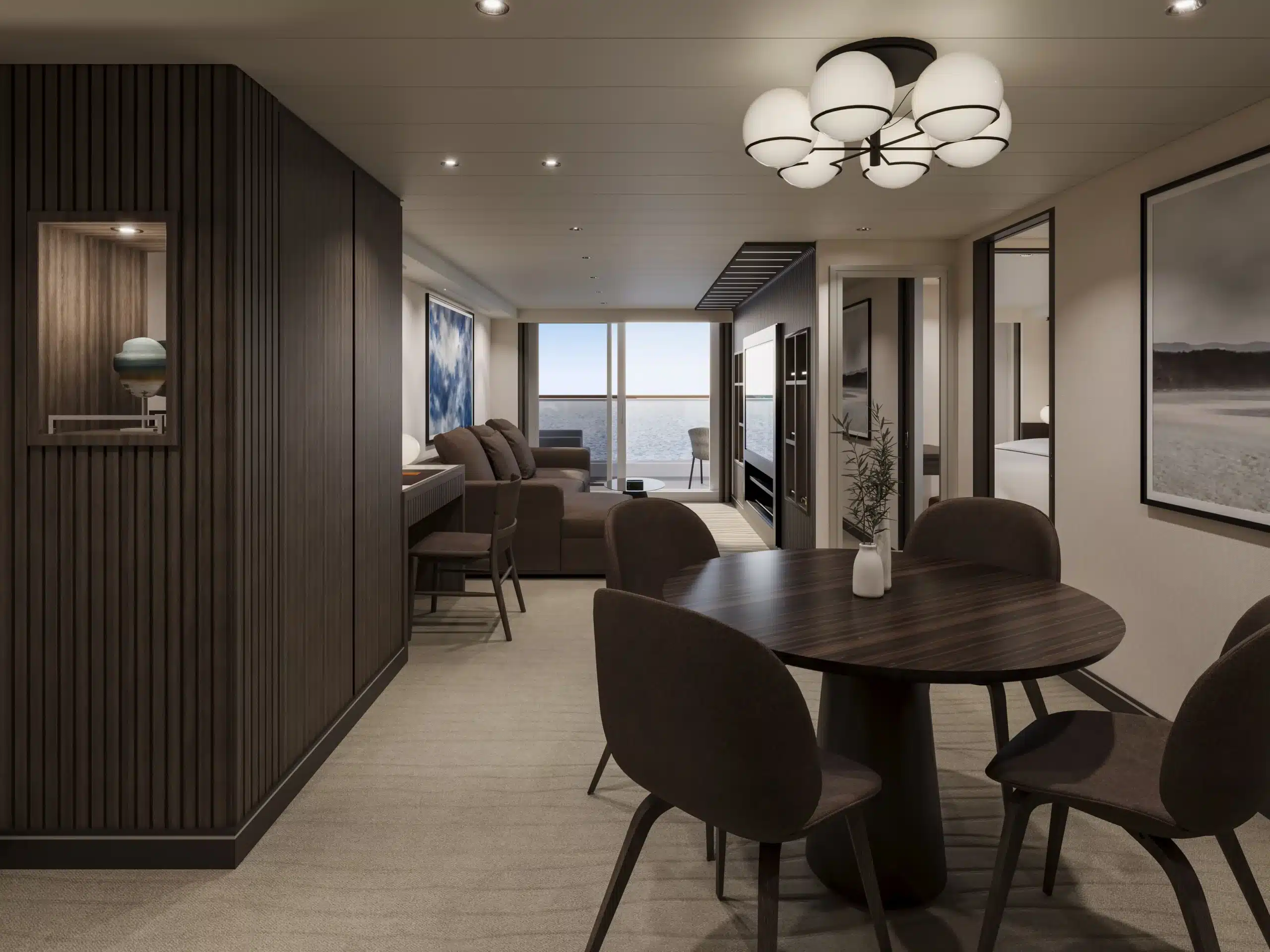 Modern interieur van de Cocoon Residence op de EXPLORA V, met een ronde eettafel, een comfortabele zithoek en een lichte woonruimte met toegang tot het terras.