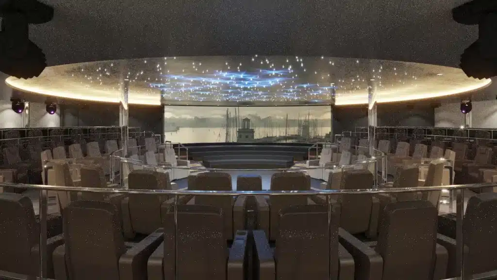 Het moderne theater aan boord van de Scenic Ikon met comfortabele fauteuils, sterrenhemel verlichting en een groot scherm.